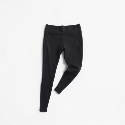 High-waisted black seamless leggings in charcoal on a white studio background.