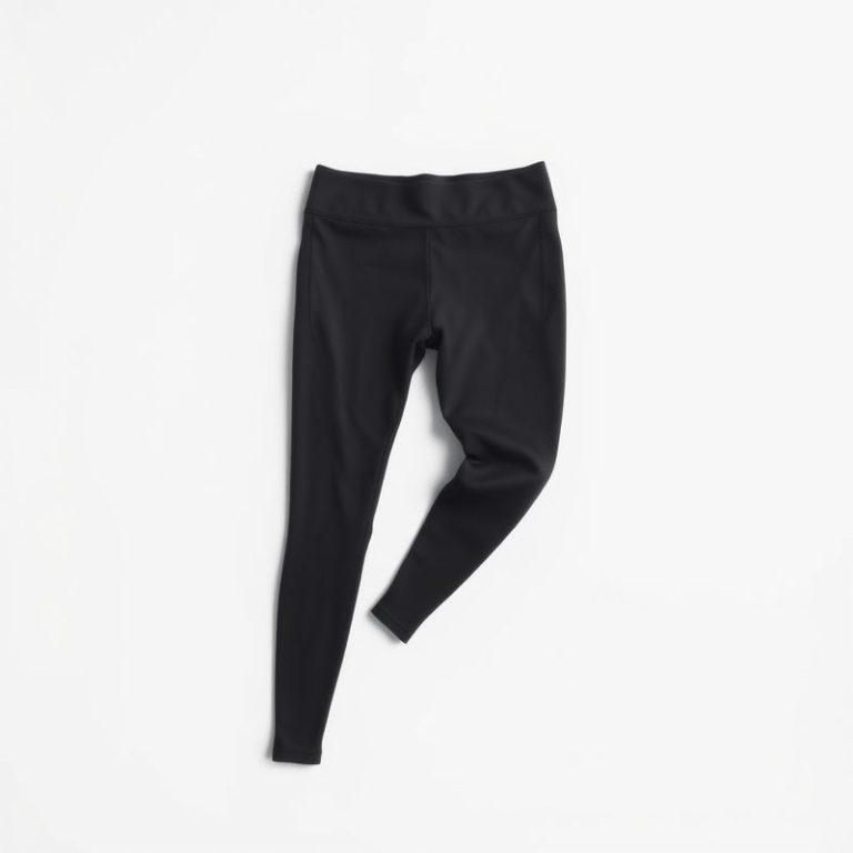 High-waisted black seamless leggings in charcoal on a white studio background.