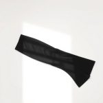 Flat lay of the best flare leggings for yoga, folded on a neutral surface.