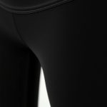 Close-up of the fabric texture and stitching on black high waisted leggings with pockets, premium yoga pants for women.