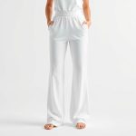 Black wide leg yoga pants with subtle scrunch detail, white background, hyperrealistic studio photo.