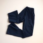 Navy Blue flared pants outfit, consciously made, folded flat on a neutral surface.