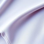 Close-up of high waisted leggings fabric, showcasing seamless stitching and premium material quality.