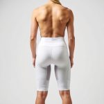 Back view of warrior 111 Christmas bike shorts in White, showcasing fit and cut on model, studio shot.