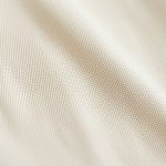 Close-up of the organic fabric texture and stitching on yoga flared pants.