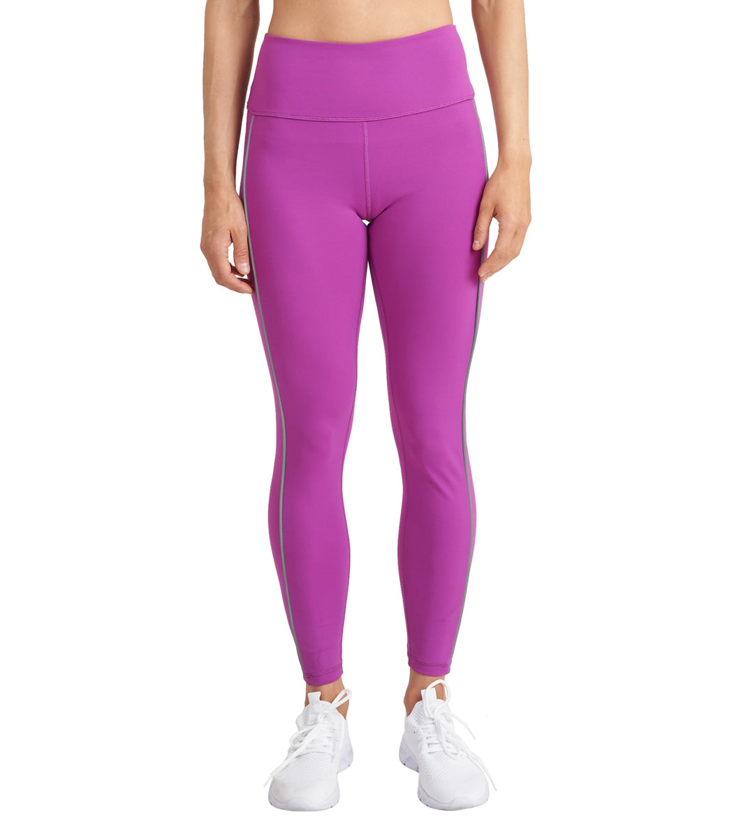 uggs in pink paired with Thrive Societe Reflective Piped Legging clover colour activewear